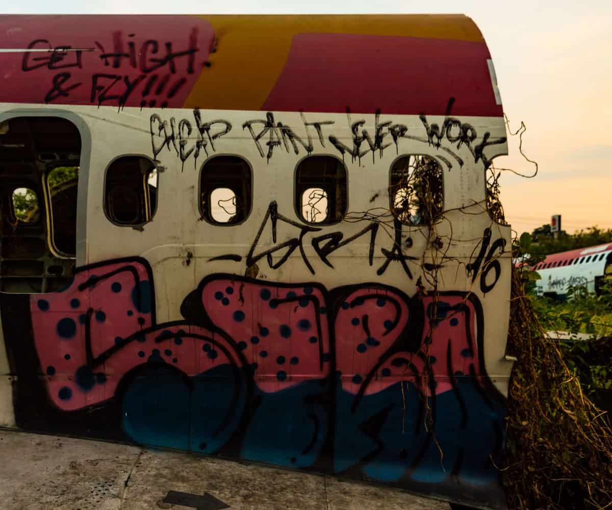 Colorful graffiti coats a lot of the planes, Plane Graveyard, Bangkok, Thailand.