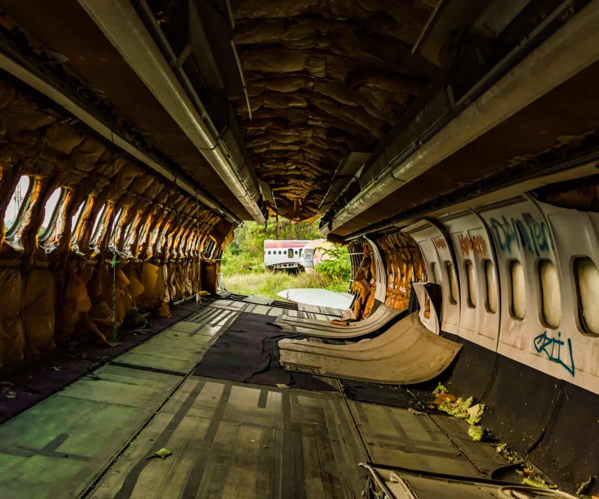 The empty passenger cabin of the Boeing 747 in Bangkok's Plane Graveyard.