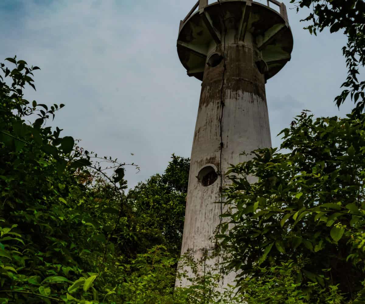 Koh Tao Lighthouse, standing strong through dense jungle, Thailand.