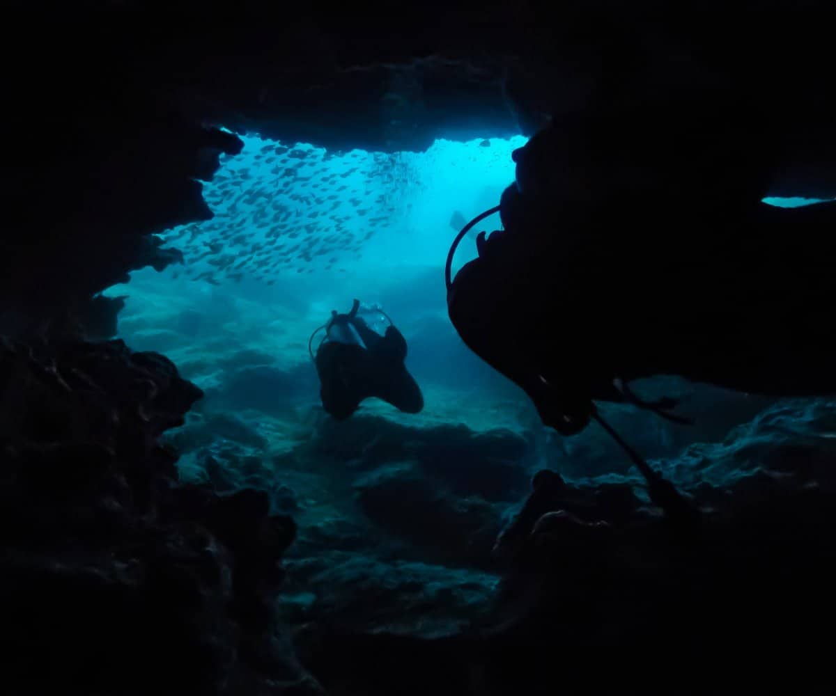 Amazing Phi Phi diving, exiting an underwater cave, Thailand.