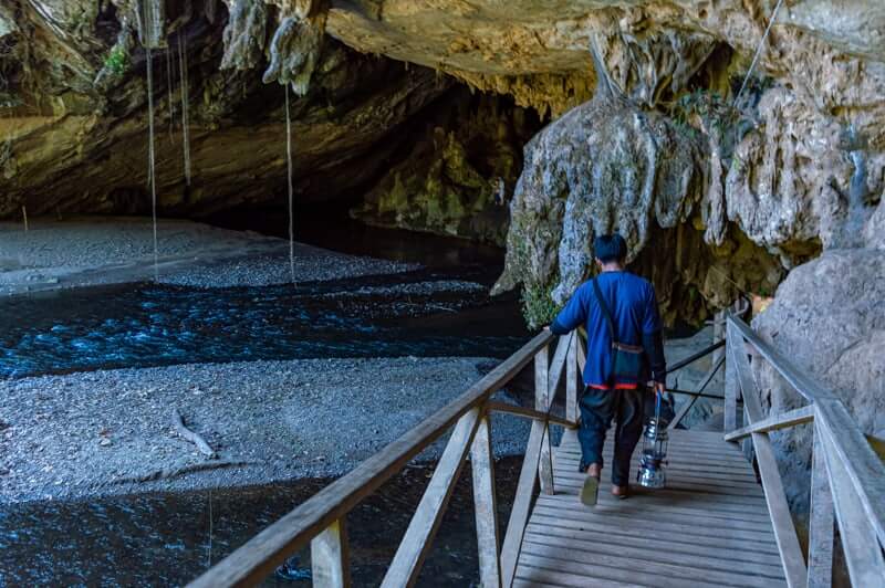 Lantern Tour Guide leads you to the Tham Lod Cave Entrance