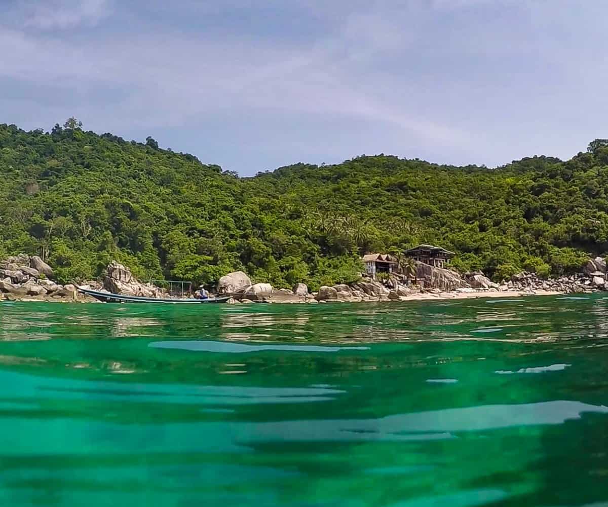 Jumping into the warm waters of the beautiful Koh Tao Island, Thailand