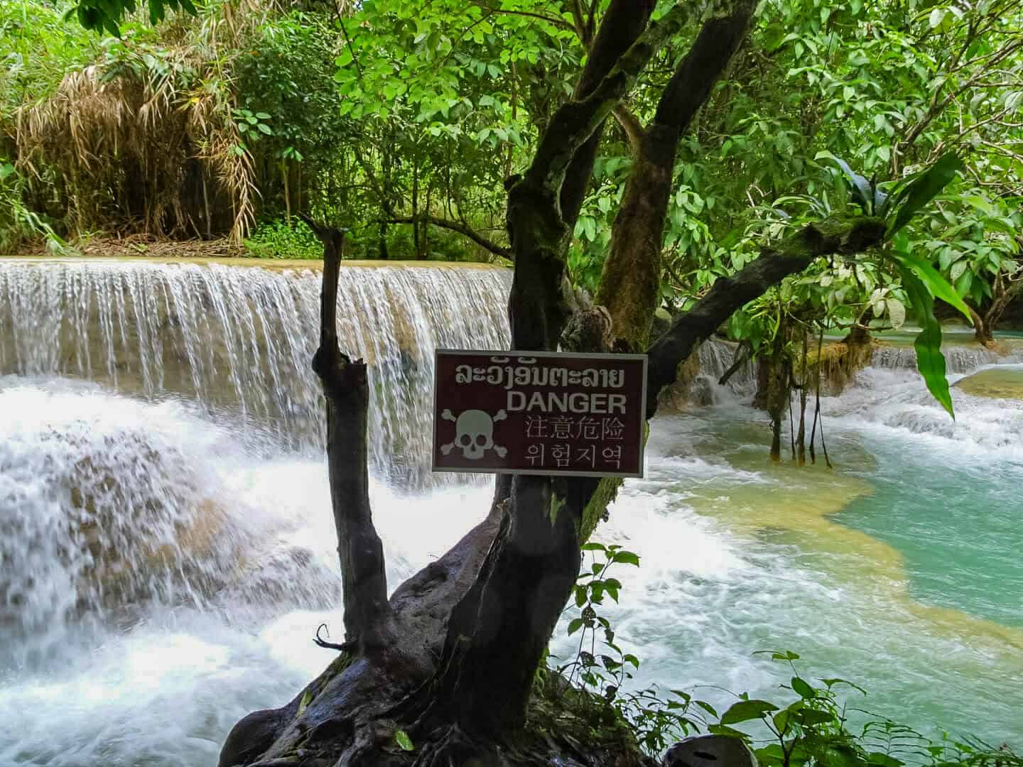 Some of the pools at Kuang Si Falls don't allow swimming. Take notice of the caution signs dotted around the site.