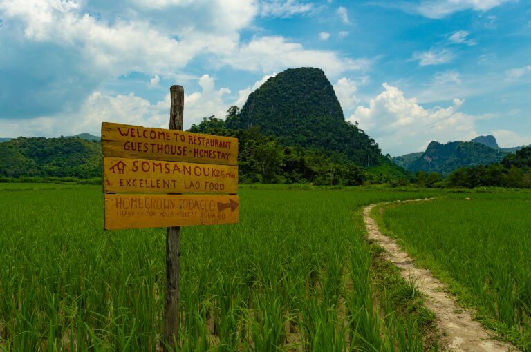 A sign points to the next village during Muang Ngoy hike