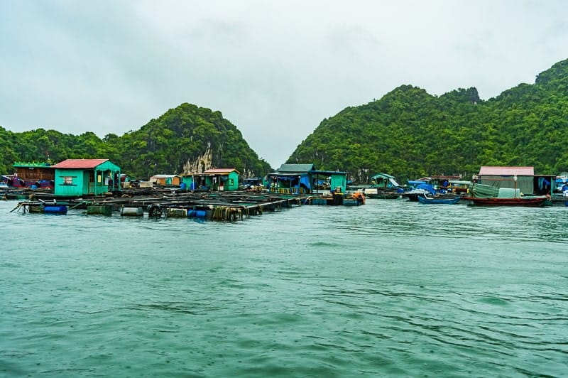 Kayaking through Lan Ha Bay gets you closer to both limestone karsts and floating villages in the area