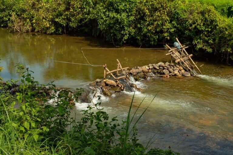 River current generates electricity by boat propellers in rural Muang Ngoy