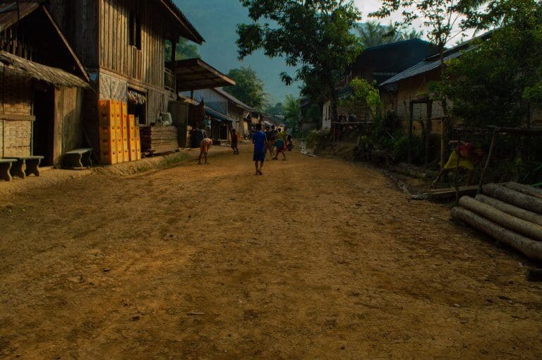Children play on the streets of a tiny village outside Muang Ngoy