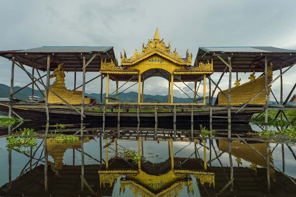A beautiful golden gilded boat on Inle Lake