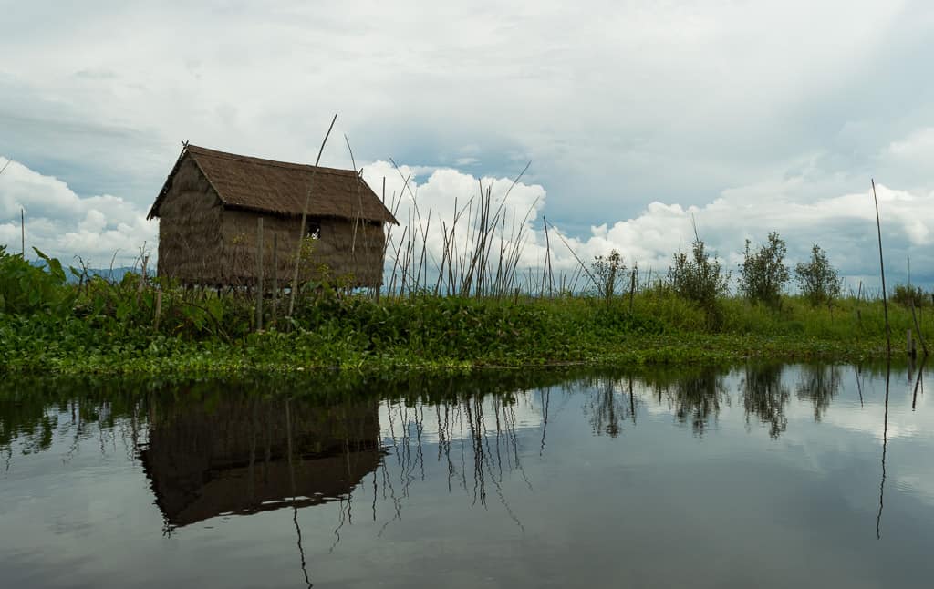 Little shack resting on stilts on the waters of Inle Lake