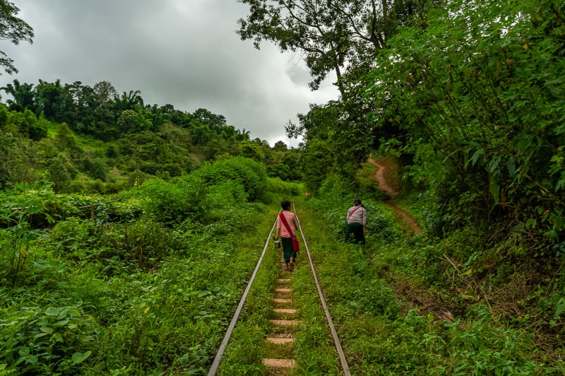 Walking along the train tracks is a popular way of transport in rural villages of Myanmar