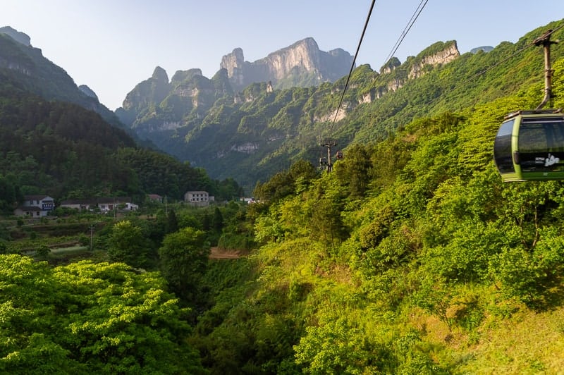 Board the cable car to Tianmen Mountain from the city of Zhangjiajie, China