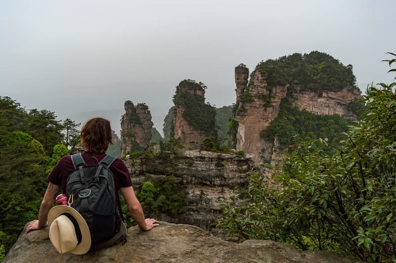 Sitting on the cliff edge in Zhangjiajie National Forest Park, China