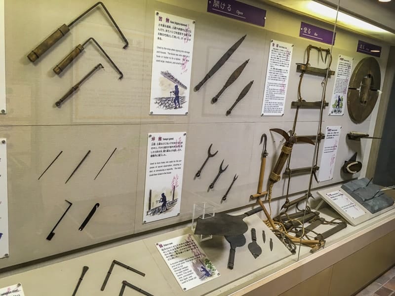 Lockpicks and daggers can be seen in this ninja display cabinet 