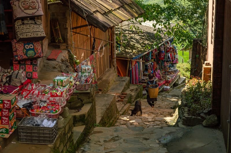 You will encounter plenty of vendors selling goods as you walk around Cat Cat Village in Vietnam