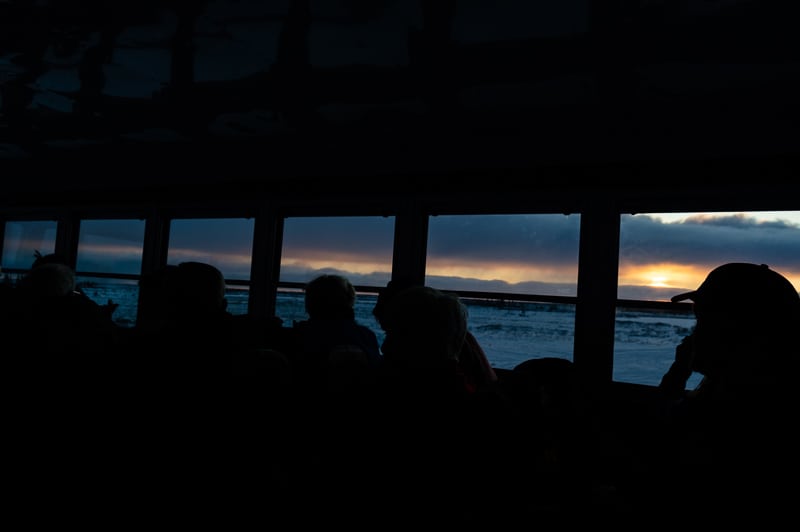 Inside the Tundra Buggy tour as the sun rises around Churchill, Manitoba